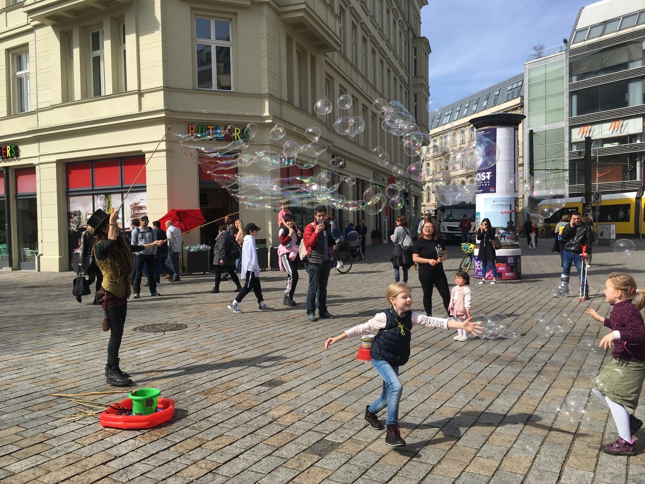 Children chasing bubbles at Hackescher Markt